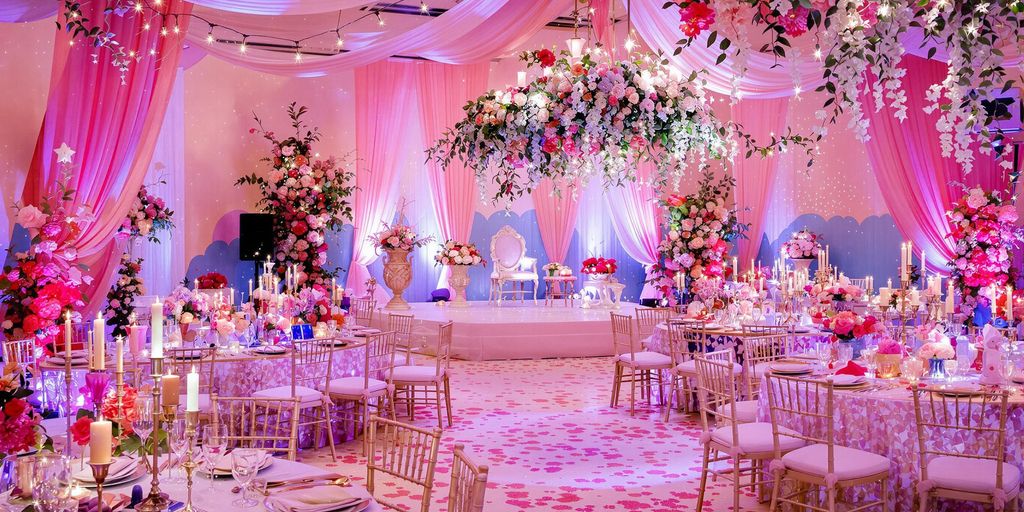 Whimsical wedding decor with colorful flowers and fairy lights.